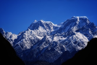 snow covered mountain under blue sky during daytime