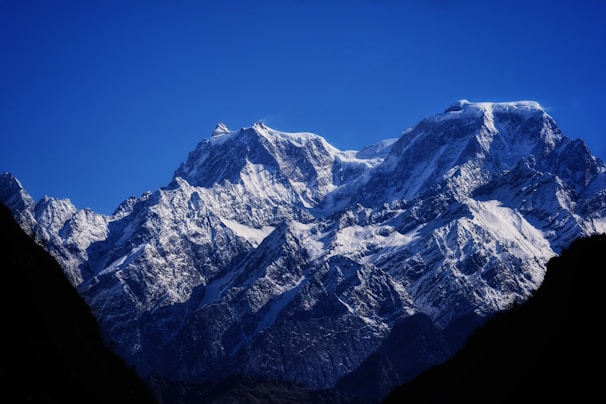 snow covered mountain under blue sky during daytime