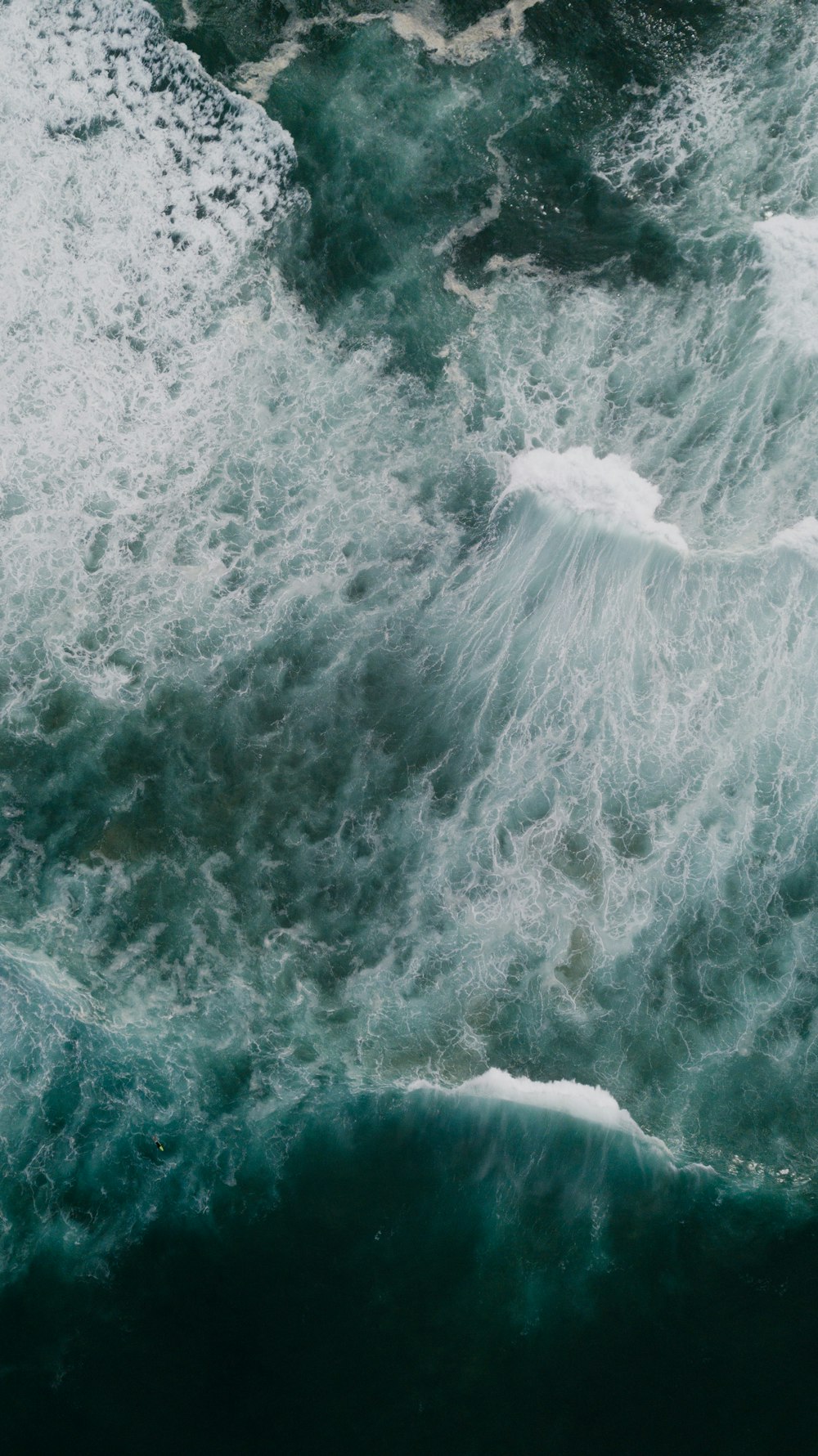 white and blue ocean waves