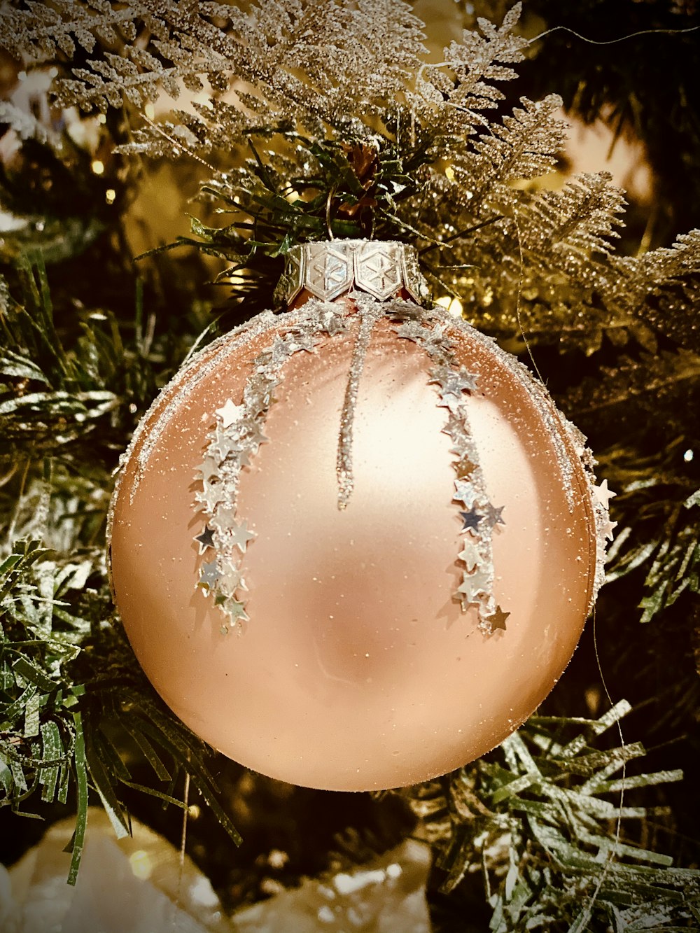 brown bauble on green pine tree