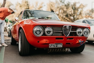 A professional inspecting a classic American car before purchase