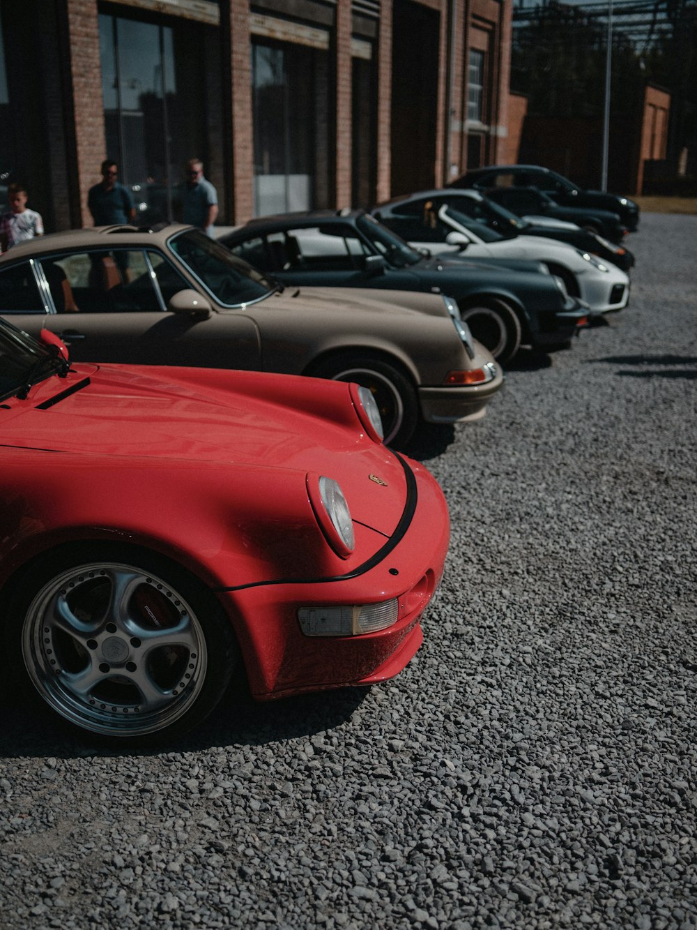 red ferrari sports car parked on parking lot during daytime