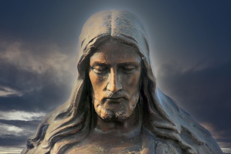 gray concrete statue under blue sky during daytime