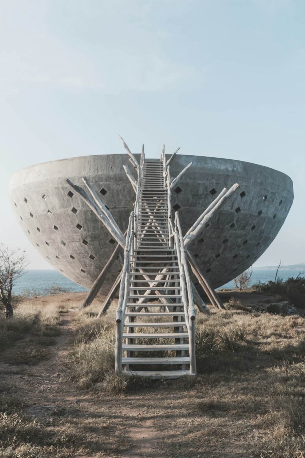 gray steel round structure under blue sky during daytime