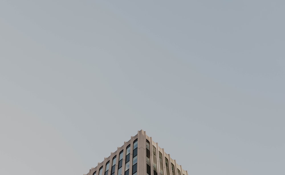 white concrete building under white sky during daytime