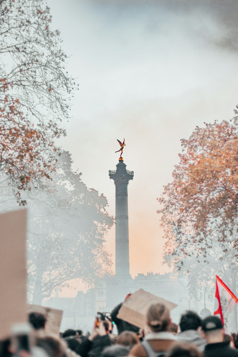 black concrete cross with red flag on top