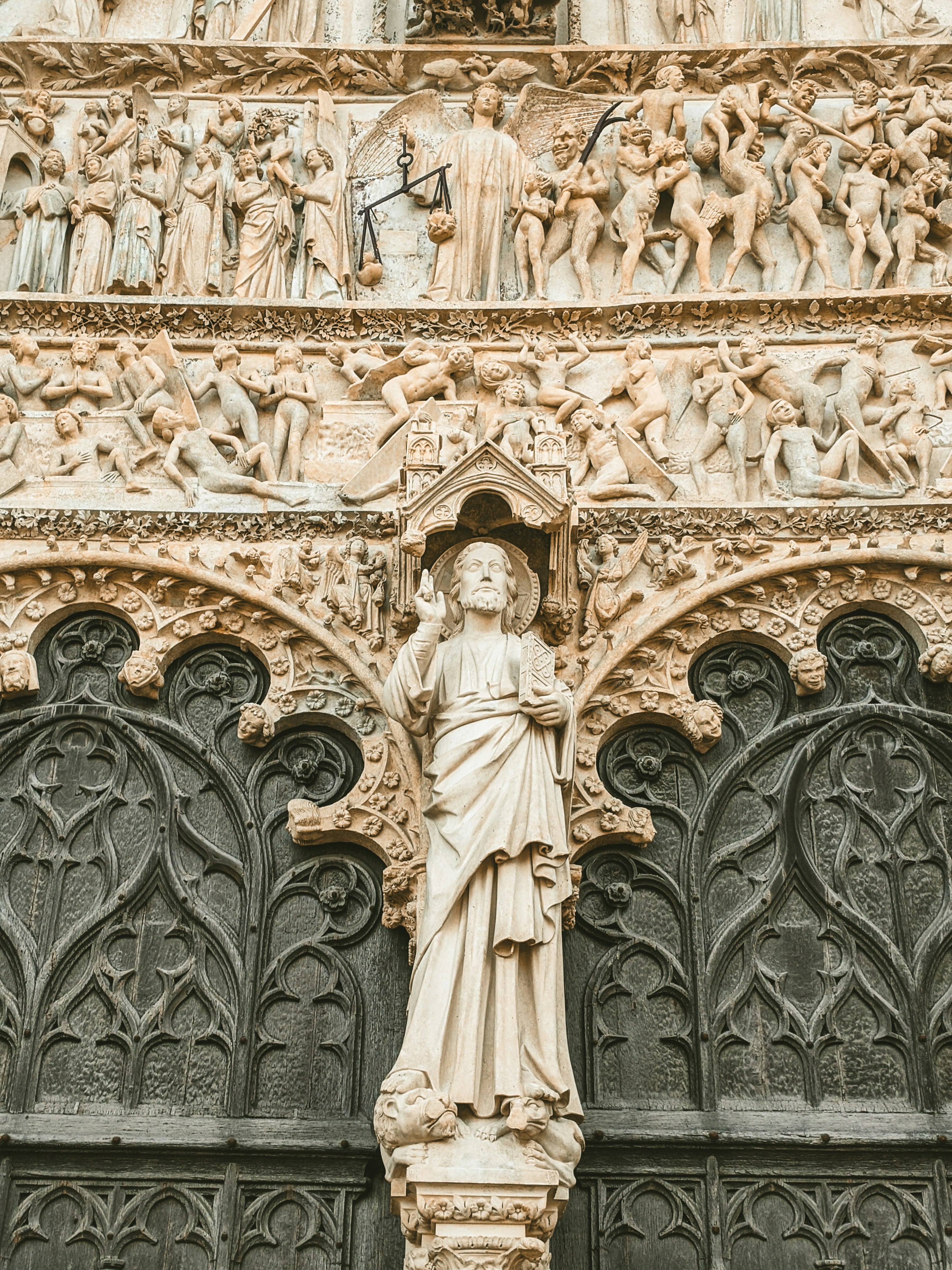 white concrete statue of a man