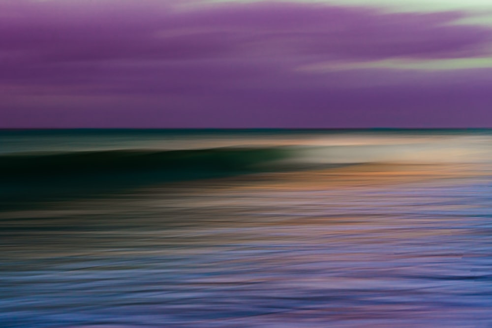 body of water under cloudy sky during daytime