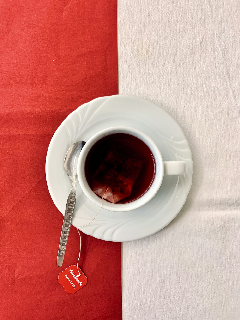 white ceramic cup on white ceramic saucer