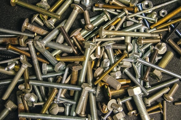 Pile of hex bolts and nuts — bulk fastener stock