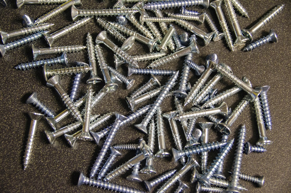 a pile of screws sitting on top of a table