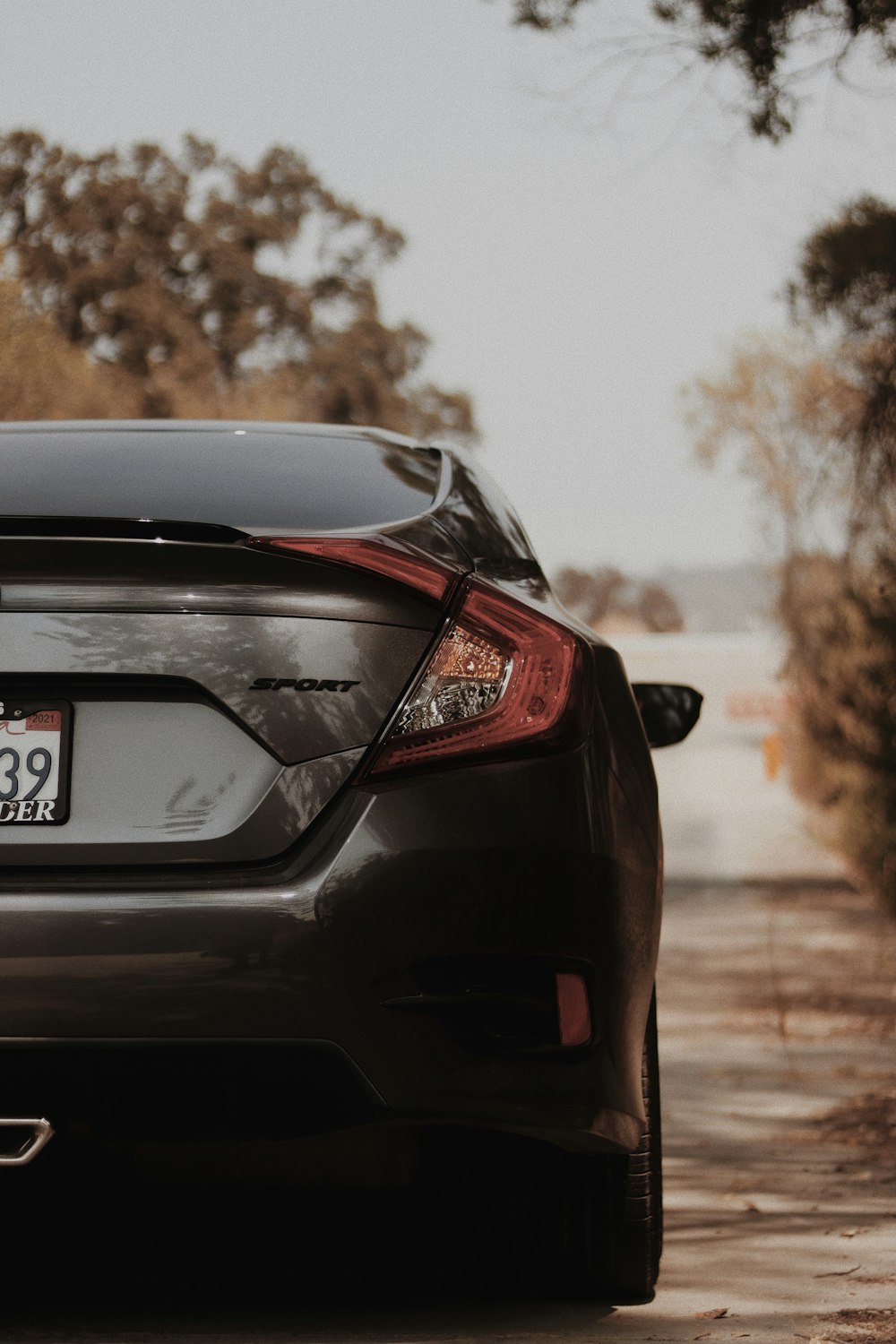 black honda car on road during daytime