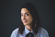 woman in white and blue checked dress shirt