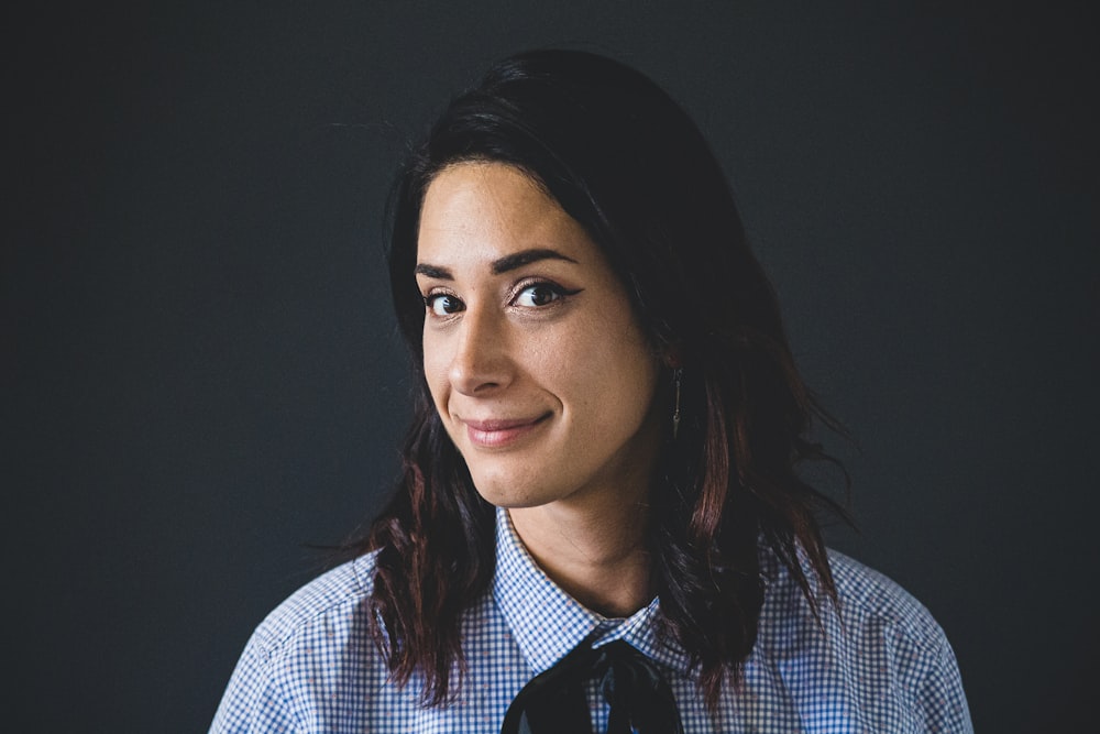 woman in white and blue checked dress shirt