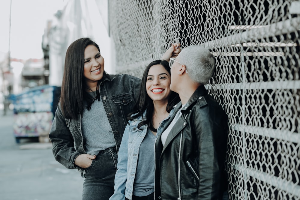 woman in black leather jacket beside woman in black leather jacket