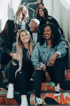 group of women laughing on stairs