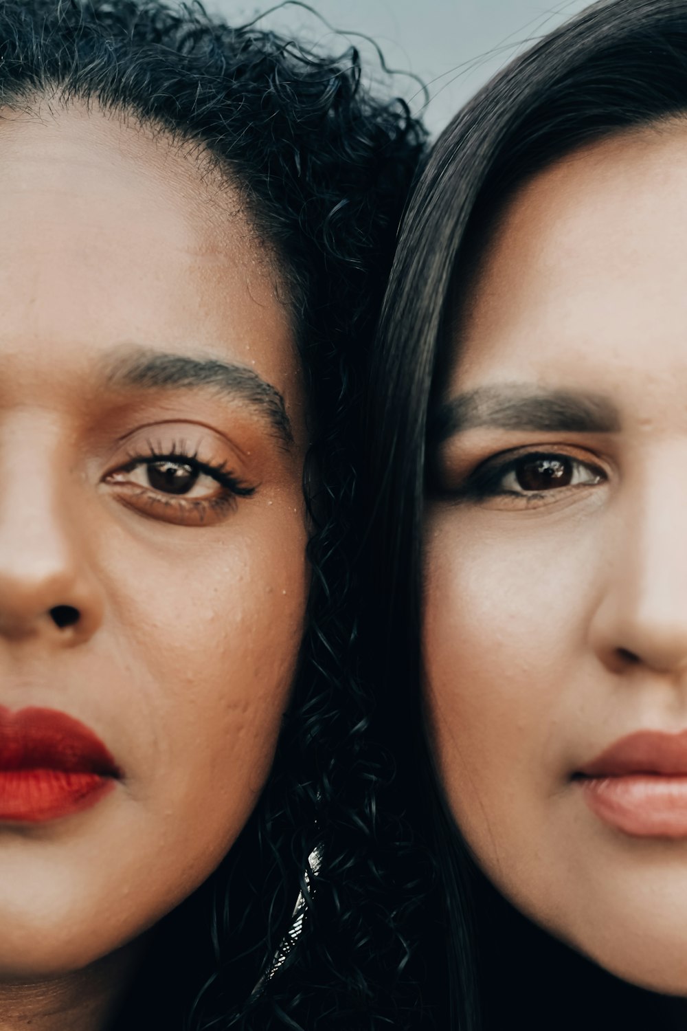 woman with red lipstick beside woman