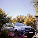 black bmw x 6 parked on the side of the road