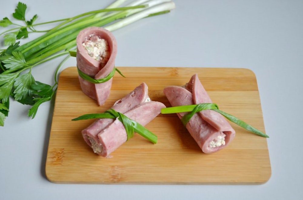 sliced vegetables on brown wooden chopping board