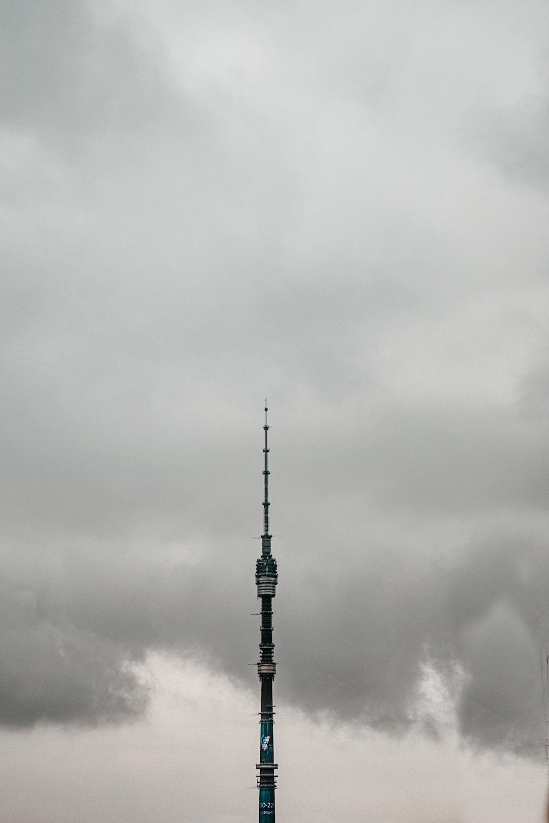 black tower under white clouds