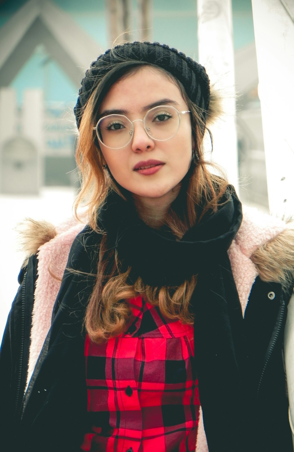 woman in black jacket wearing black framed eyeglasses