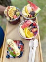 Açaí being served in a traditional cup with a spoon ready to enjoy