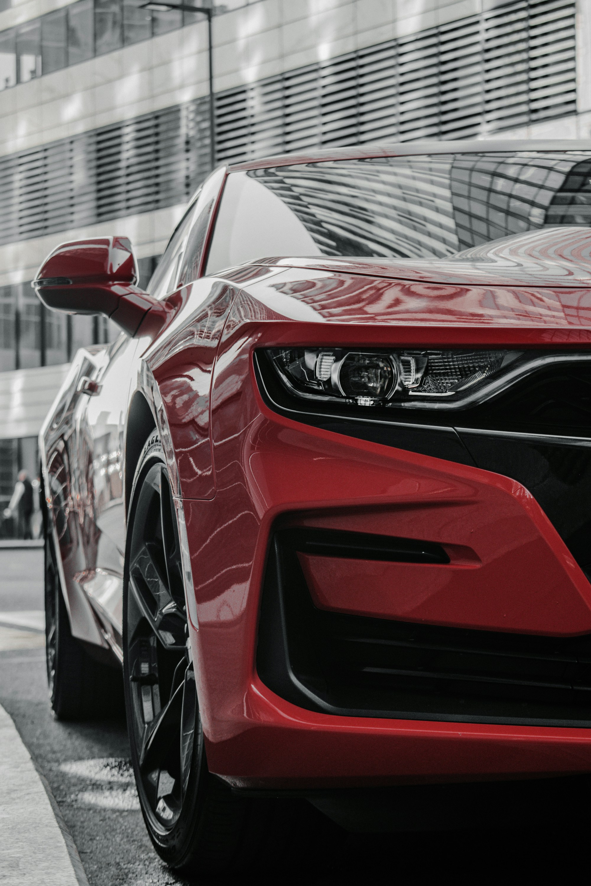 The same kind of car, clean and glossy red after detailing