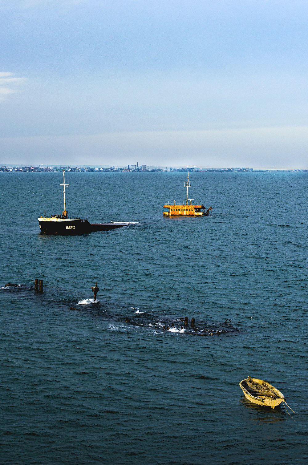 people swimming on sea during daytime