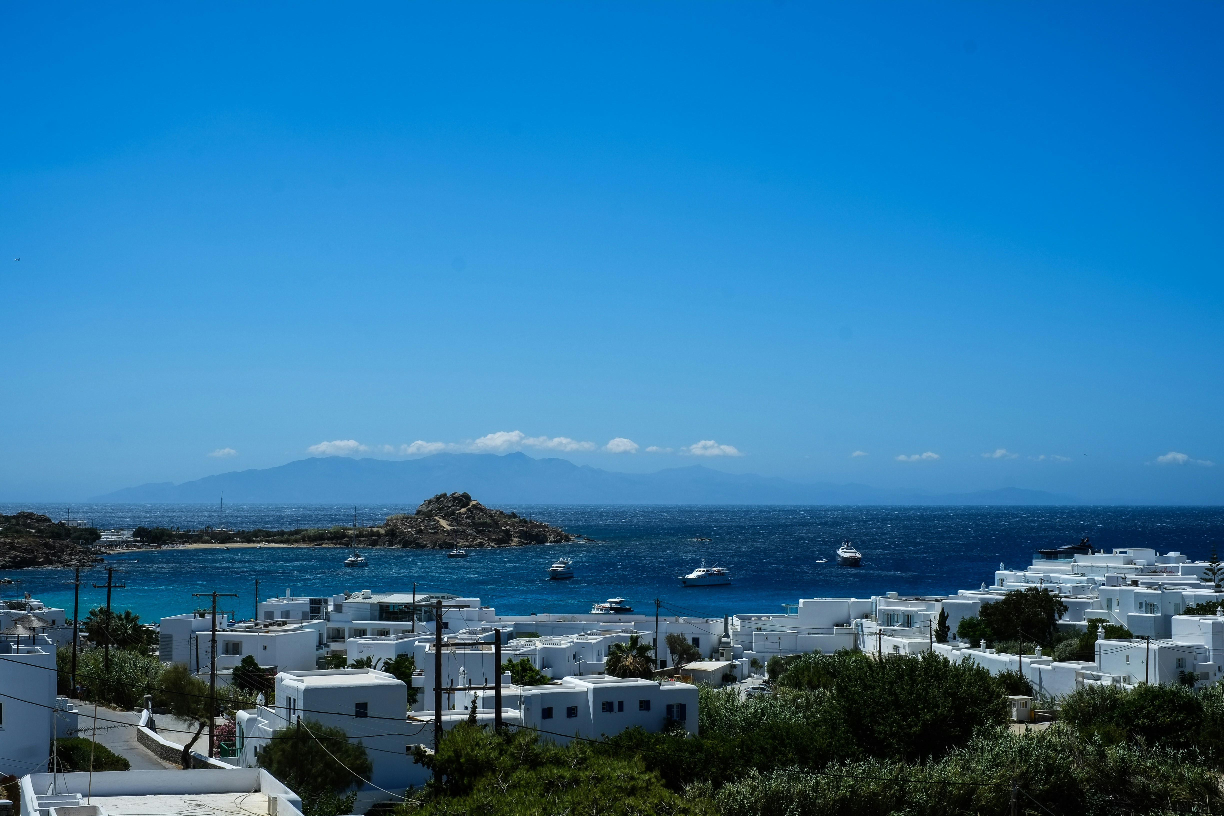 white and blue buildings near sea during daytime