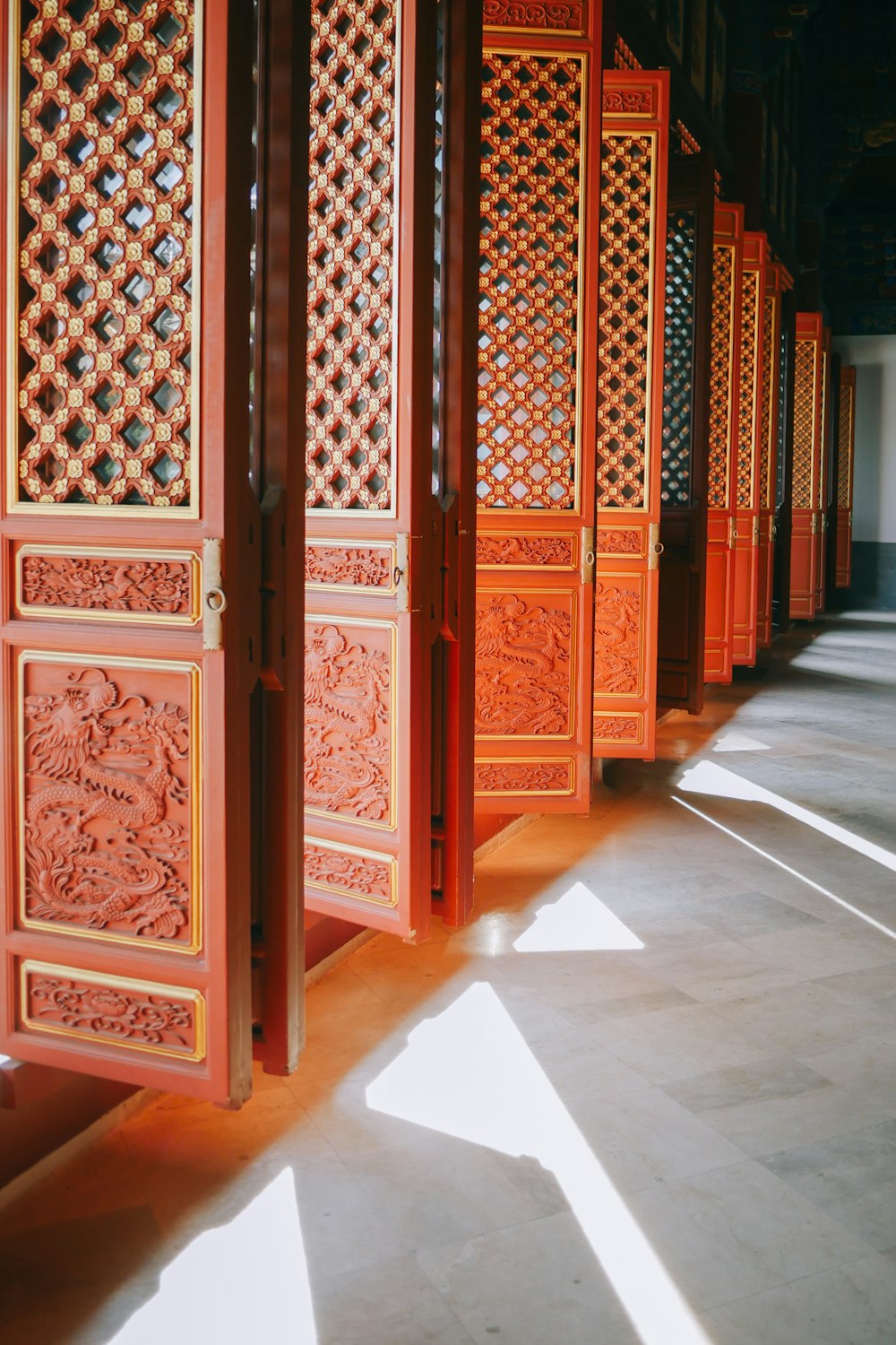 brown wooden door on white and brown ceramic tiles