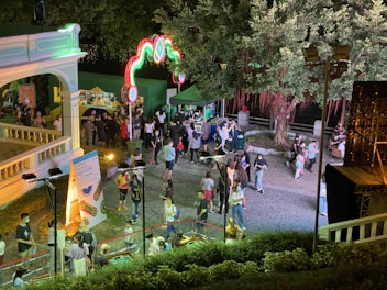 An engaging outdoor event with people interacting with branded installations.