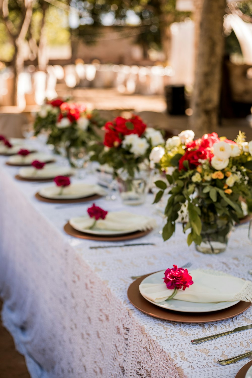 red and white flowers on white ceramic plate