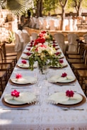 Elegant table setup for an outdoor anniversary celebration.