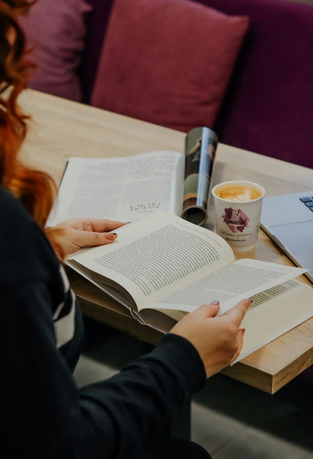 woman in black long sleeve shirt reading book