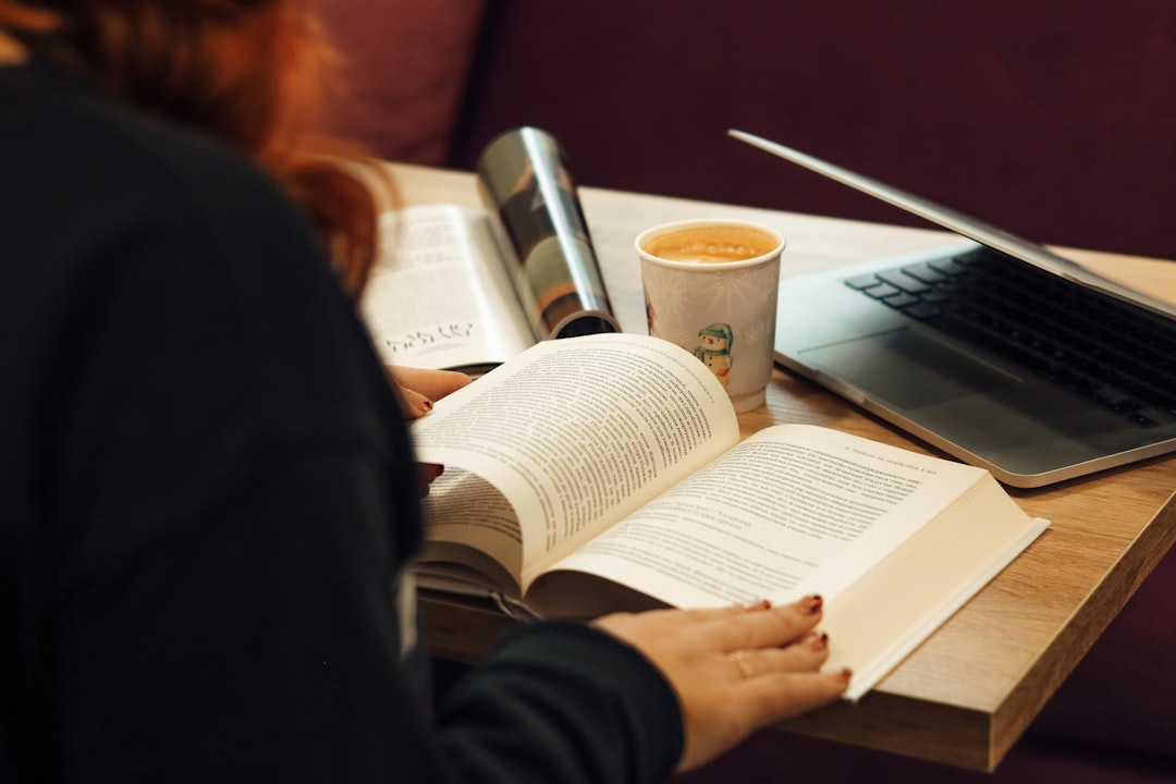 woman in black long sleeve shirt reading book