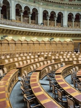 brown wooden chairs on white concrete building
