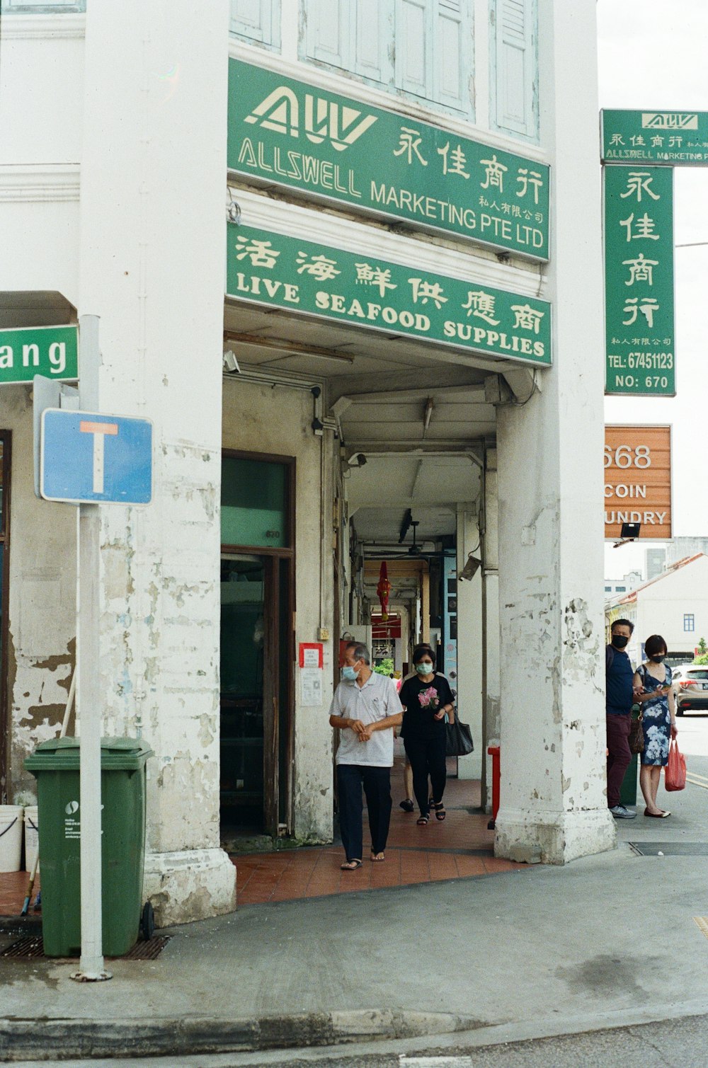 people walking on sidewalk during daytime