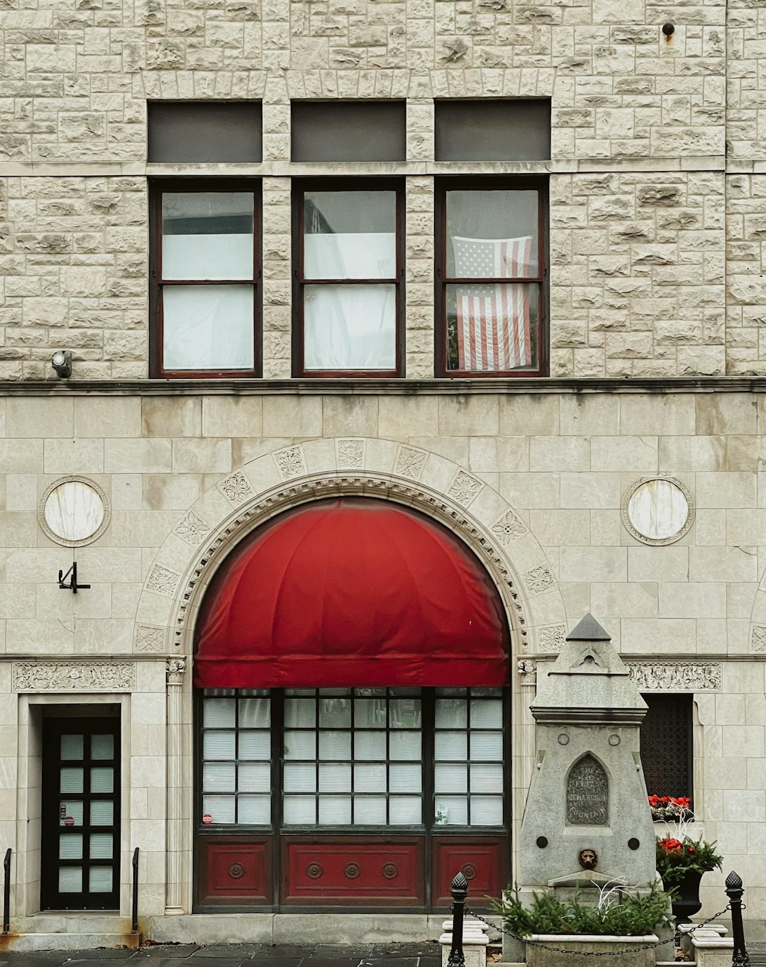 red door on brown concrete building