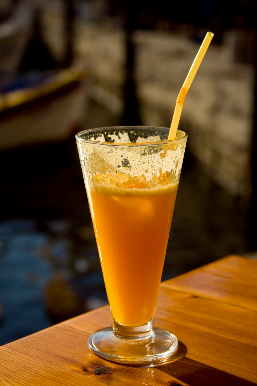 clear drinking glass with yellow liquid