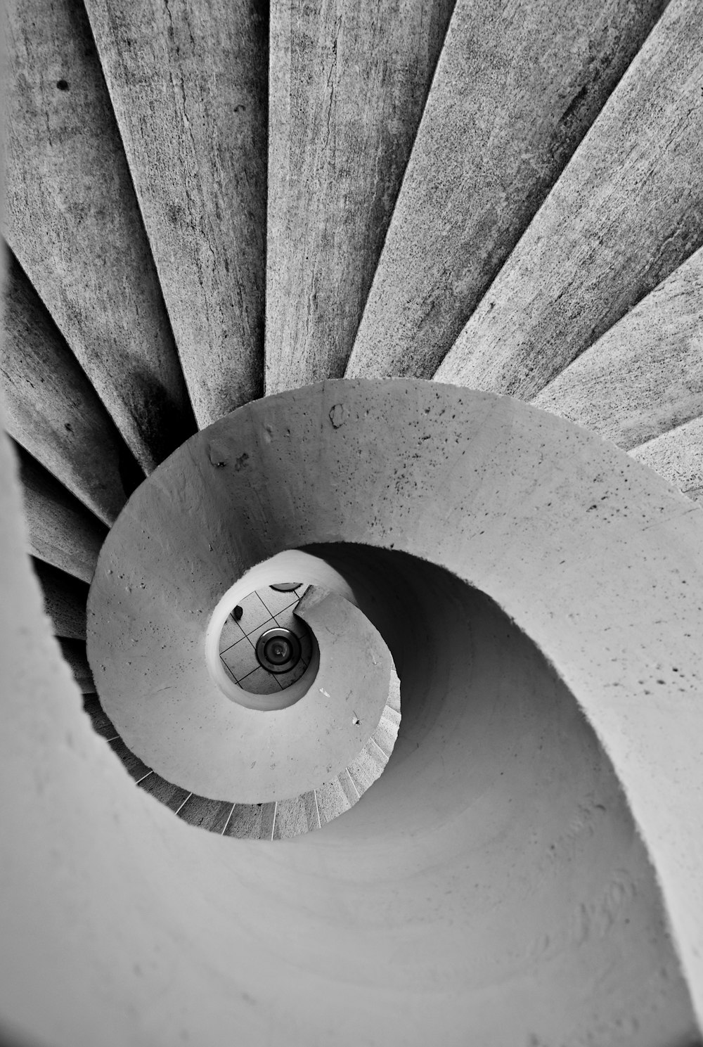 grayscale photo of spiral staircase