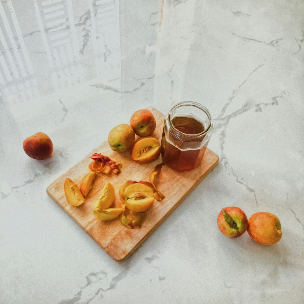 apple fruits on brown wooden chopping board