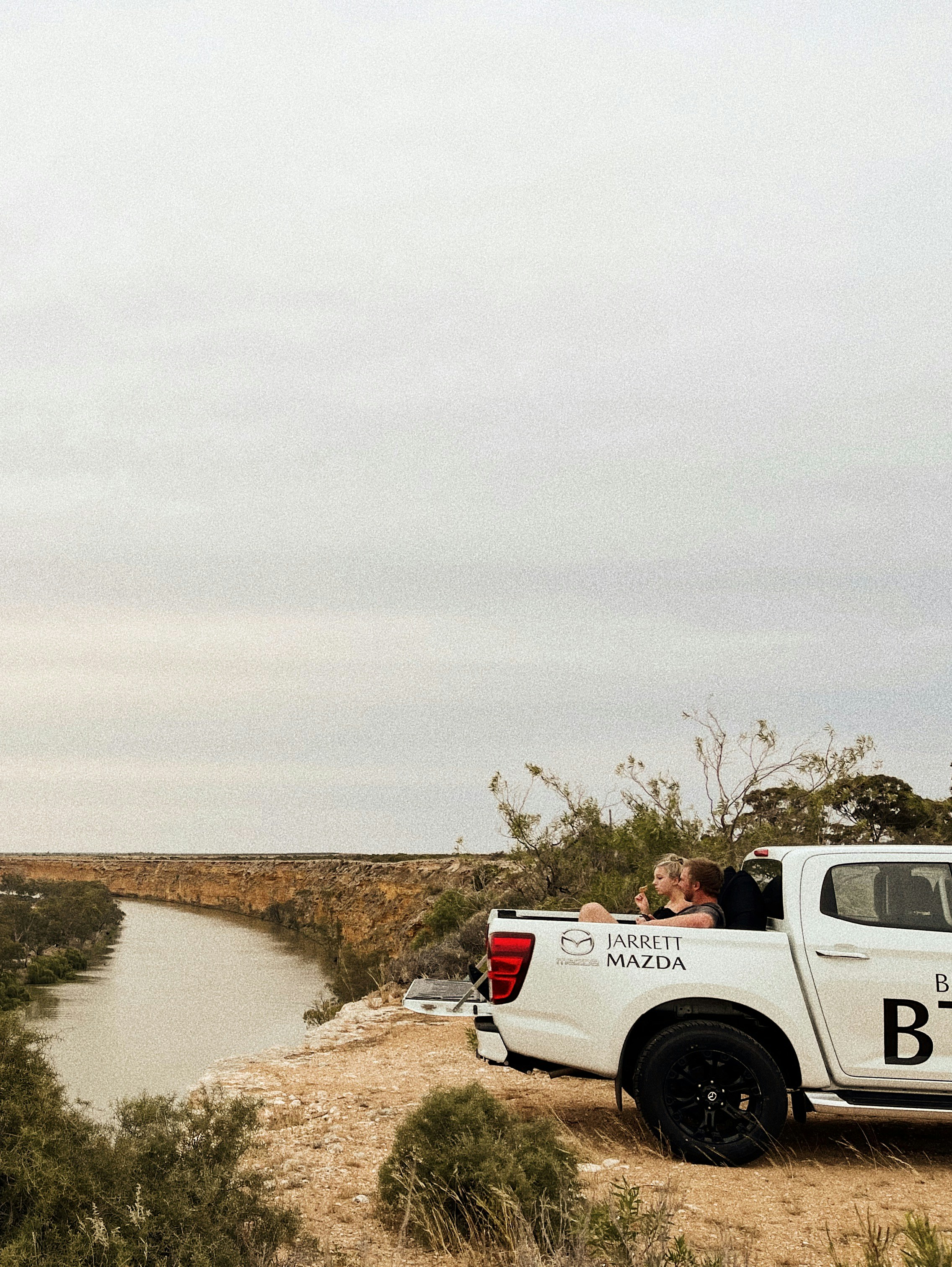 white and black jeep wrangler on dirt road during daytime