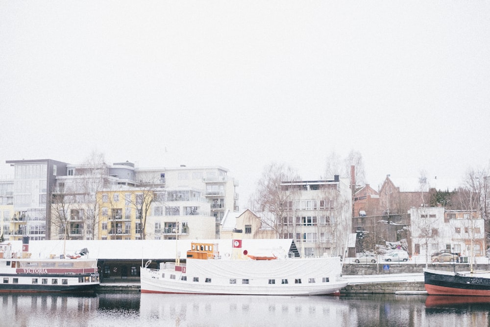 white and black boat on body of water during daytime