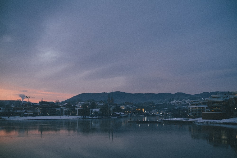 body of water near city during night time