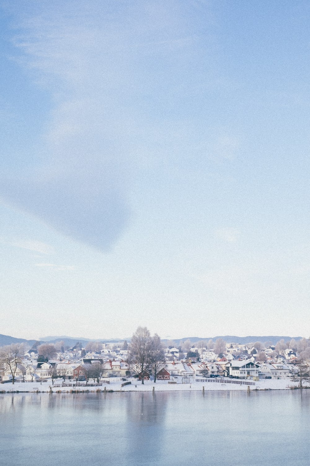 city buildings under white clouds during daytime