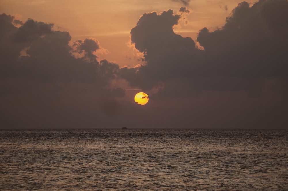 yellow balloon floating on sea during daytime