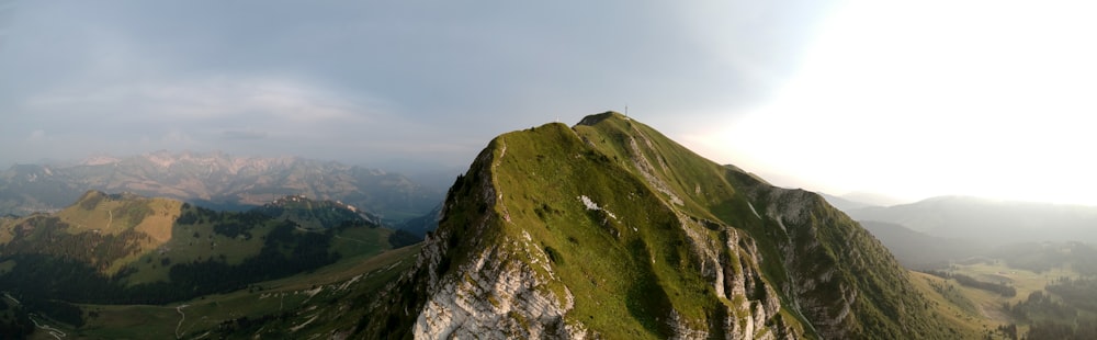 green and gray mountain under white sky during daytime