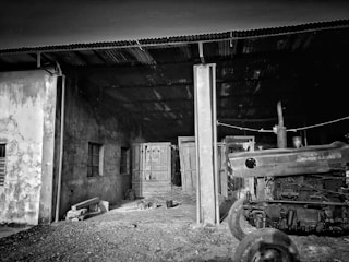 Photo of original tractor parts neatly arranged in a warehouse.