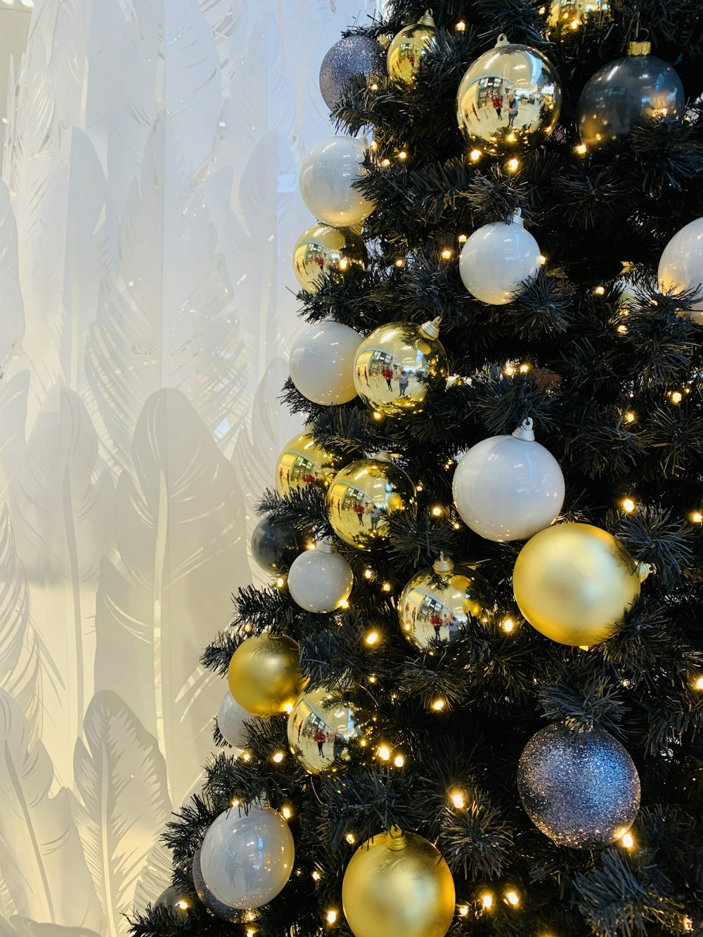 silver and blue baubles on white textile