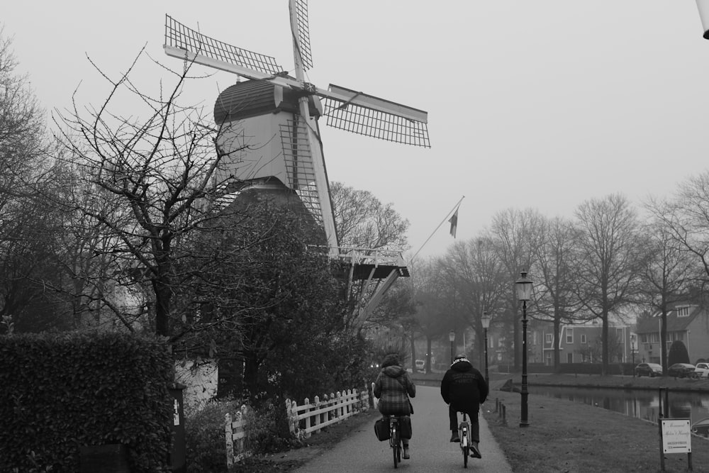 grayscale photo of people walking on street